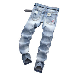 Light-colored stretch ripped jeans