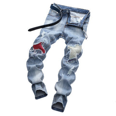 Light-colored stretch ripped jeans