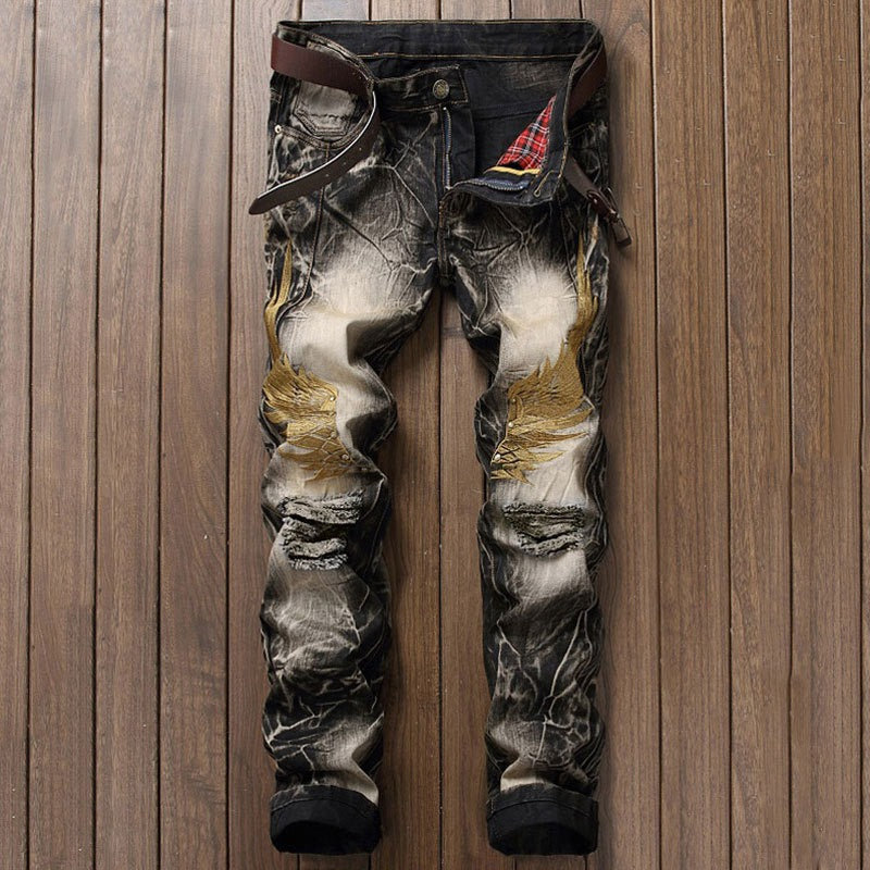 Embroidered wings ripped jeans
